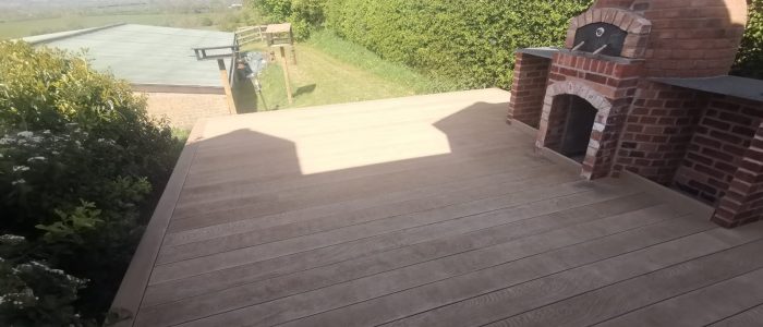 Millboard decking complete with a stone oven